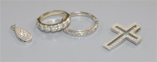 Two 18ct gold and diamond half eternity rings and two diamond set pendants including 9ct white gold.